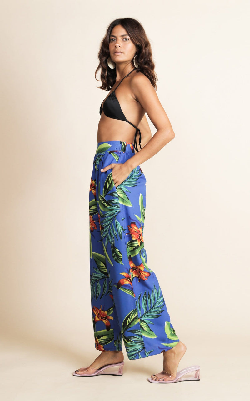 Dancing Leopard model wearing Joey Palazzo Trousers in Blue Tropical facing side on