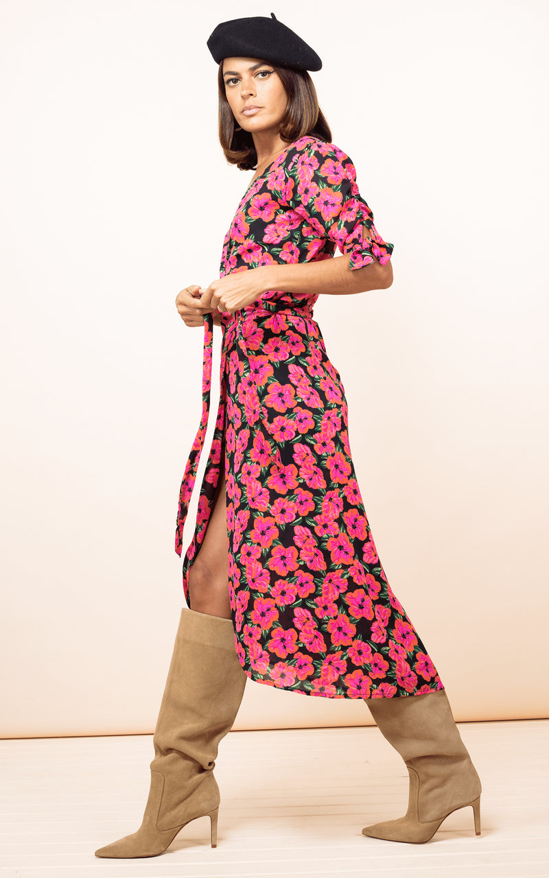 Dancing Leopard model wearing Olivera Midi Dress in Hibiscus Pink on Black walking from right to left