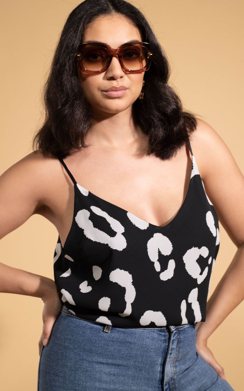 Dancing Leopard model wearing Birdie Cami Top in Oversized Mono Leopard with sunglasses