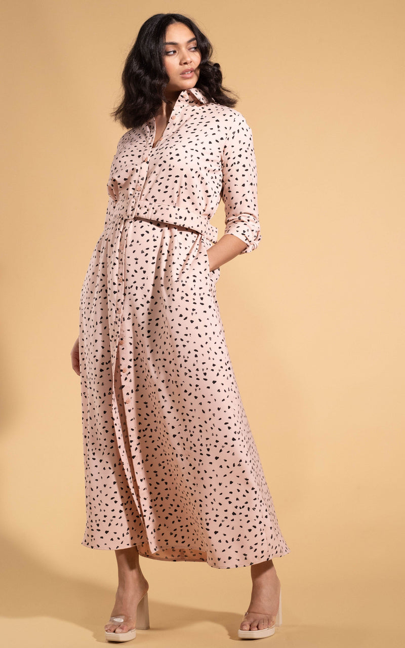 Dancing Leopard model wearing Dove Dress in Abstract Black on Beige posed with hand in pocket