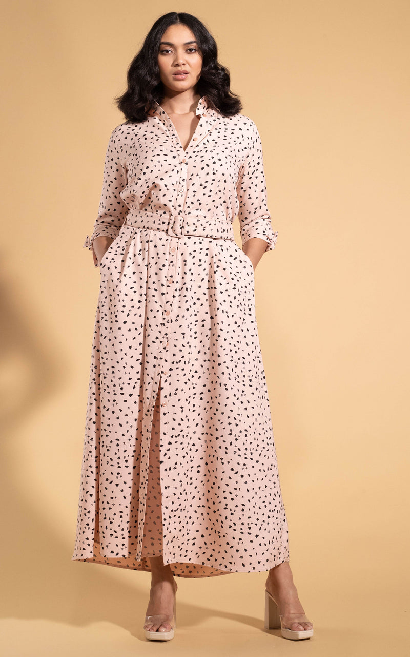 Dancing Leopard model wearing Dove Dress in Abstract Black on Beige posed with hands in pockets