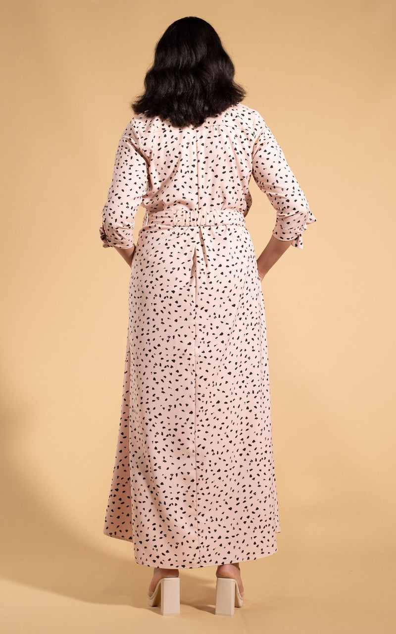 Dancing Leopard model wearing Dove Dress in Abstract Black on Beige facing away to reveal back details