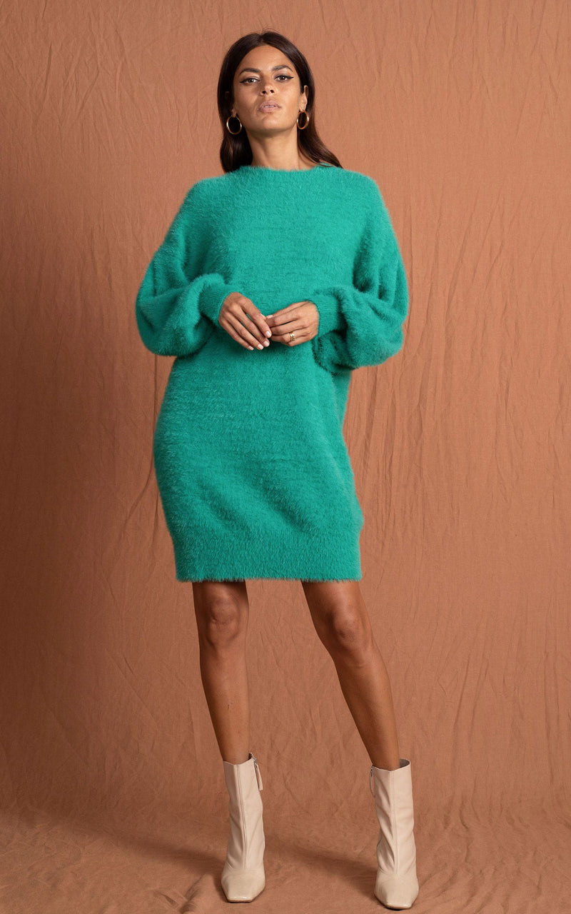 Dancing Leopard model wearing Maggie Jumper Dress in Vivid Green with ankle boots