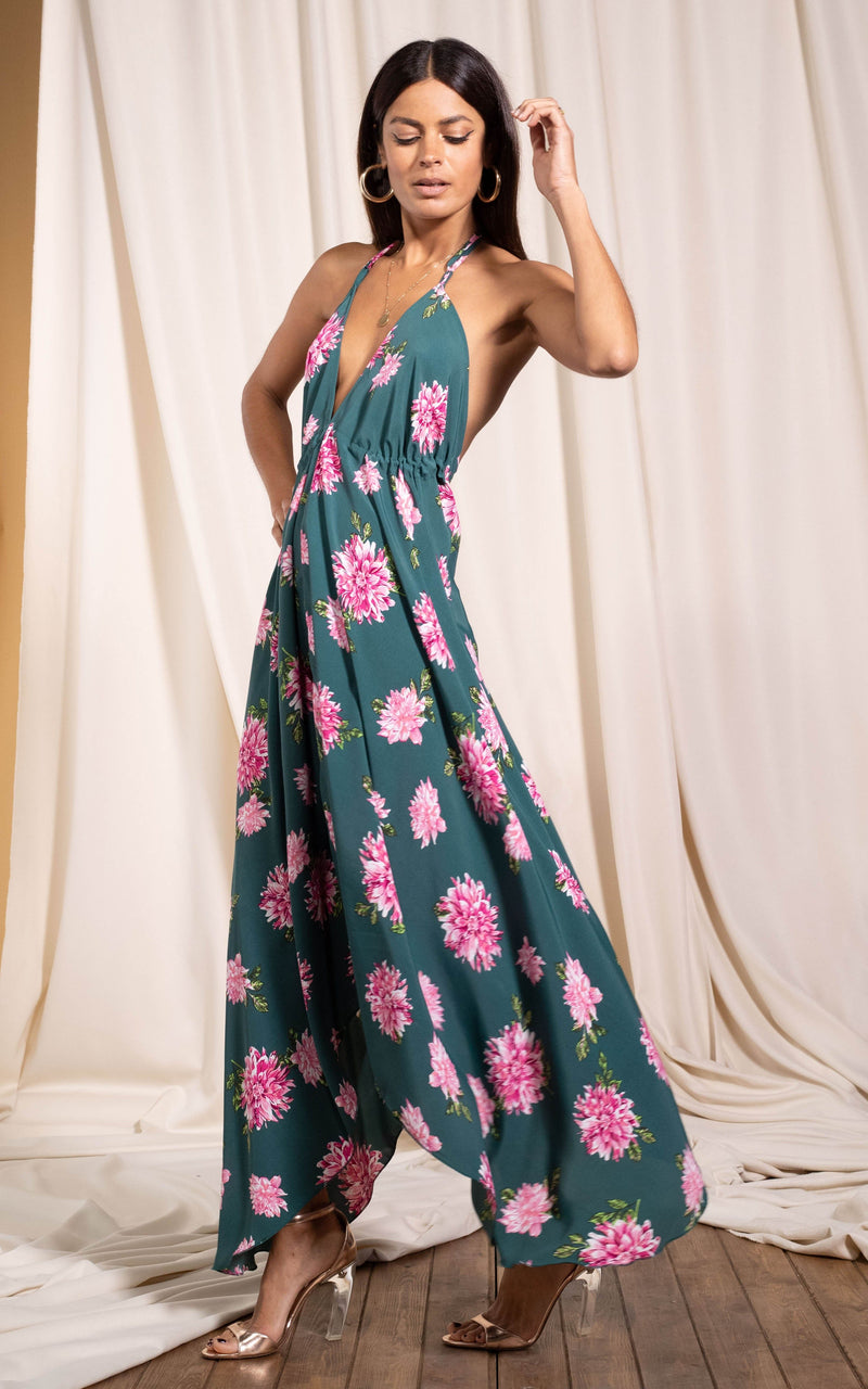 Dancing Leopard model standing sideways with hand in the air wearing boho maxi dress in dahlia 