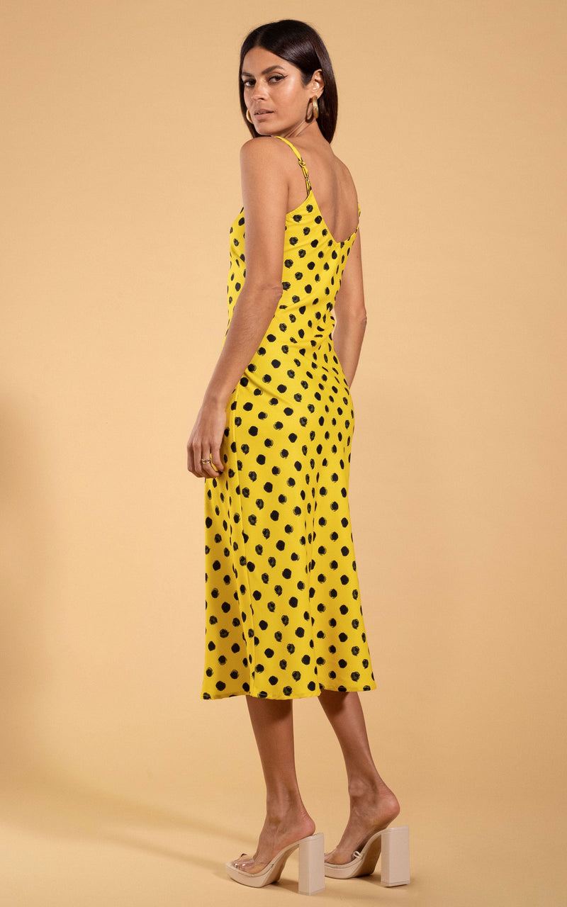 Dancing Leopard model standing with back to the camera wearing block heels and looking over shoulder