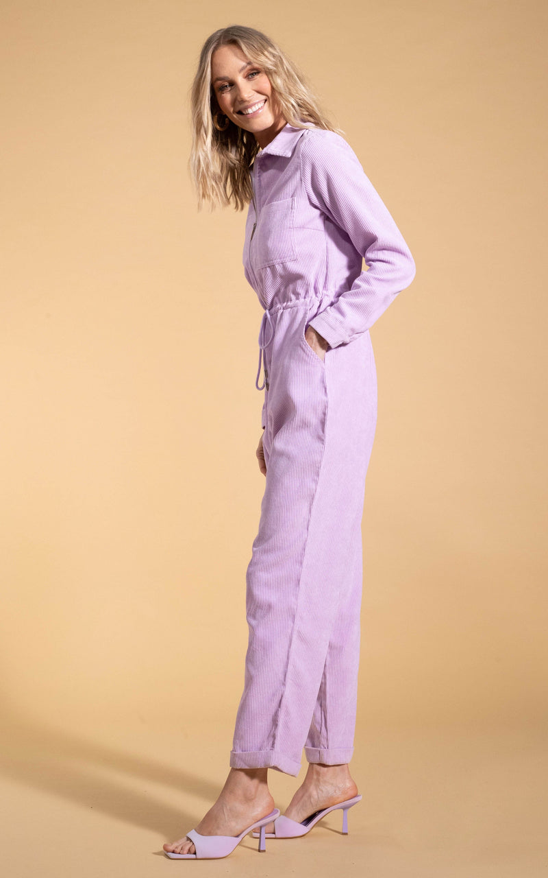 Dancing Leopard model wearing Blaze Boilersuit in Lilac posed smiling and leaning over