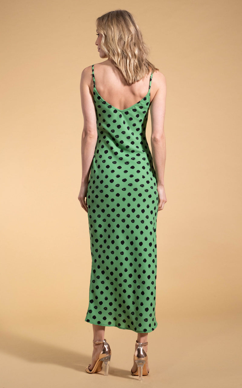 Dancing Leopard model standing with back to the camera  wearing Sienna midaxi dress in green polka dot