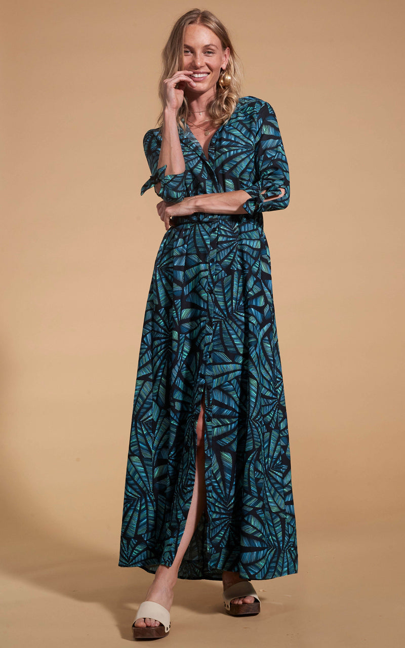 Dancing Leopard model wearing Dove Dress in Fan Turquoise on Black posed laughing
