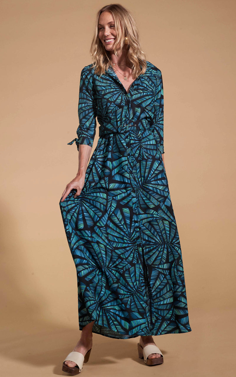 Dancing Leopard model wearing Dove Dress in Fan Turquoise on Black holding skirt out