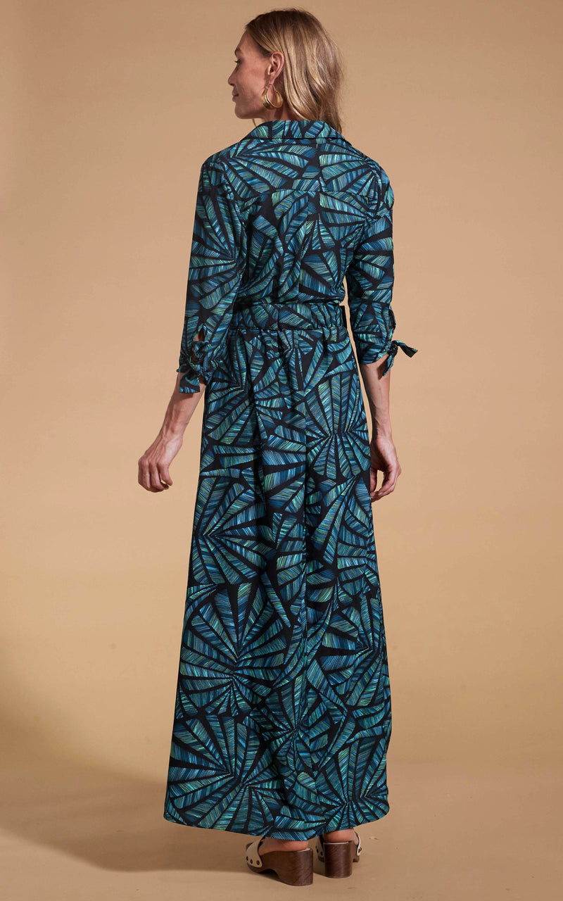 Dancing Leopard model wearing Dove Dress in Fan Turquoise on Black facing away to reveal back details