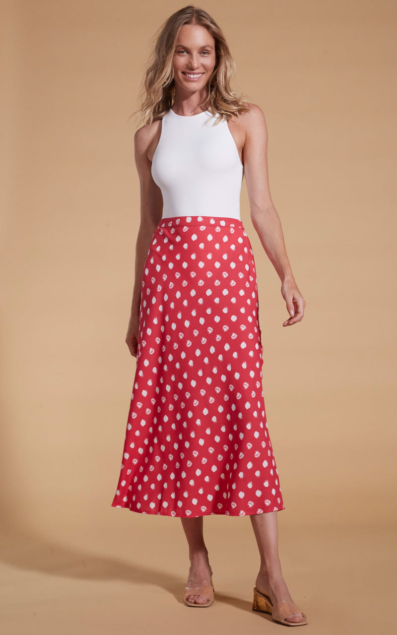 Dancing Leopard model wearing Renzo Skirt In Red Polka Dot with white top