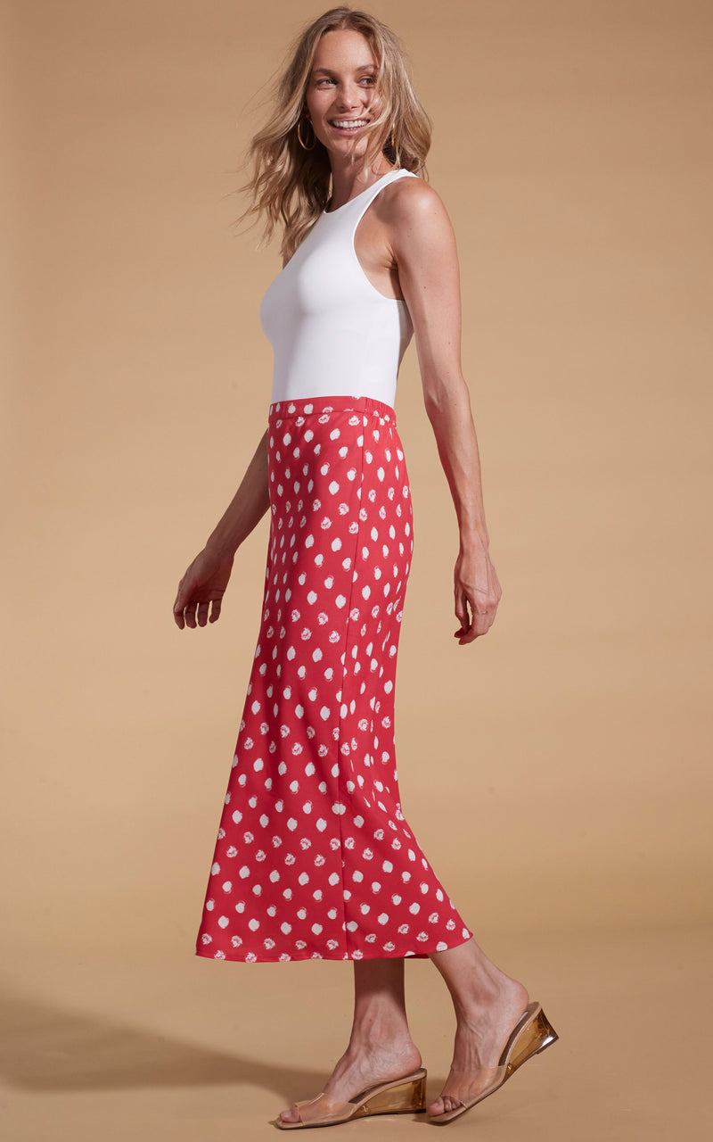 Dancing Leopard model wearing Renzo Skirt In Red Polka Dot facing side on