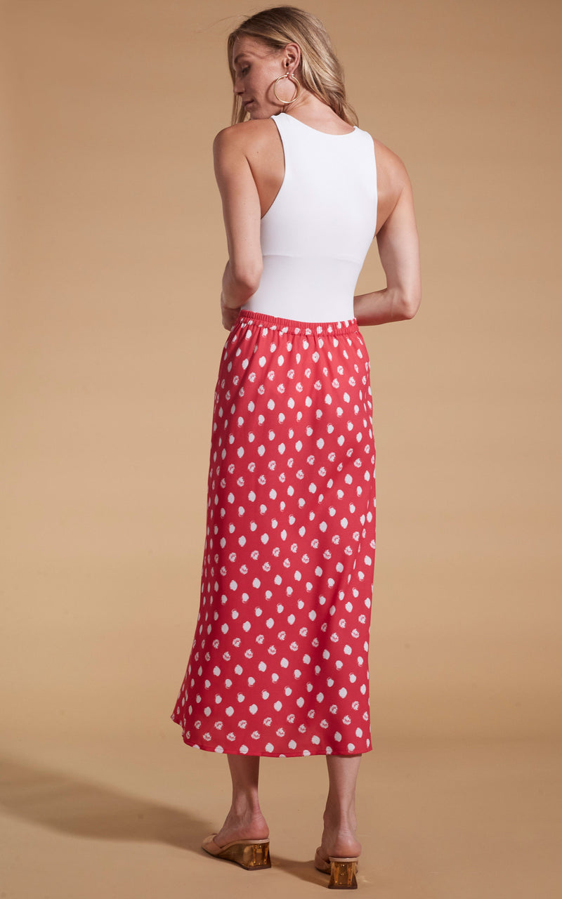 Dancing Leopard model wearing Renzo Skirt In Red Polka Dot facing away to show back of skirt
