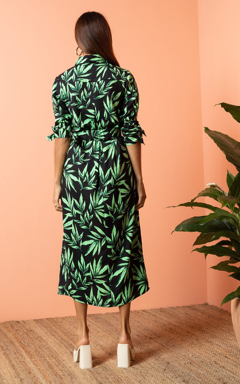 Dancing Leopard model wearing Alva Midi Shirt Dress in Tropic Green on Black facing away to reveal back details