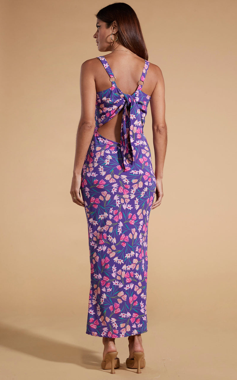 Dancing Leopard model wearing Sabrina Midaxi Dress in Purple Tulip facing away to show back of dress