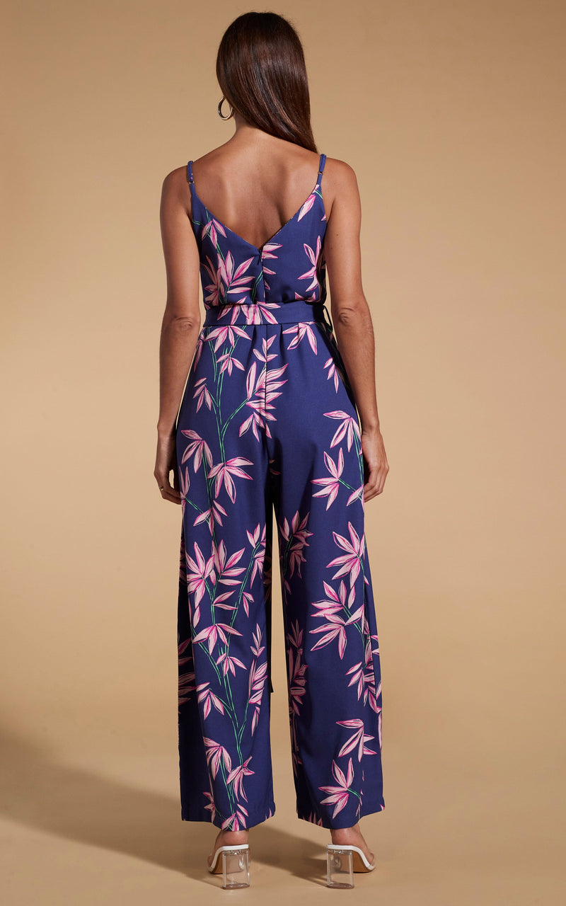 Dancing Leopard model standing with back to the camera wearing Gabriella jumpsuit in bamboo navy base