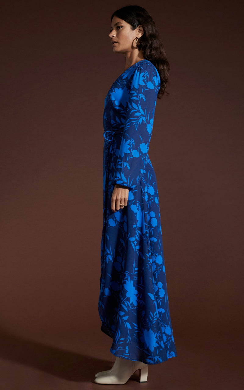 Dancing Leopard model wearing Jagger Maxi Dress in Silhouette Dark Blue facing side on