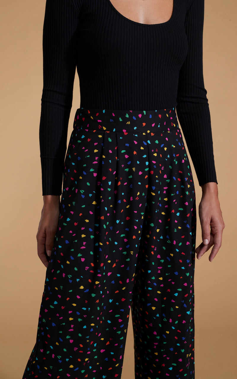 close up of Dancing Leopard model wearing Joey Palazzo Trousers in Abstract Multi