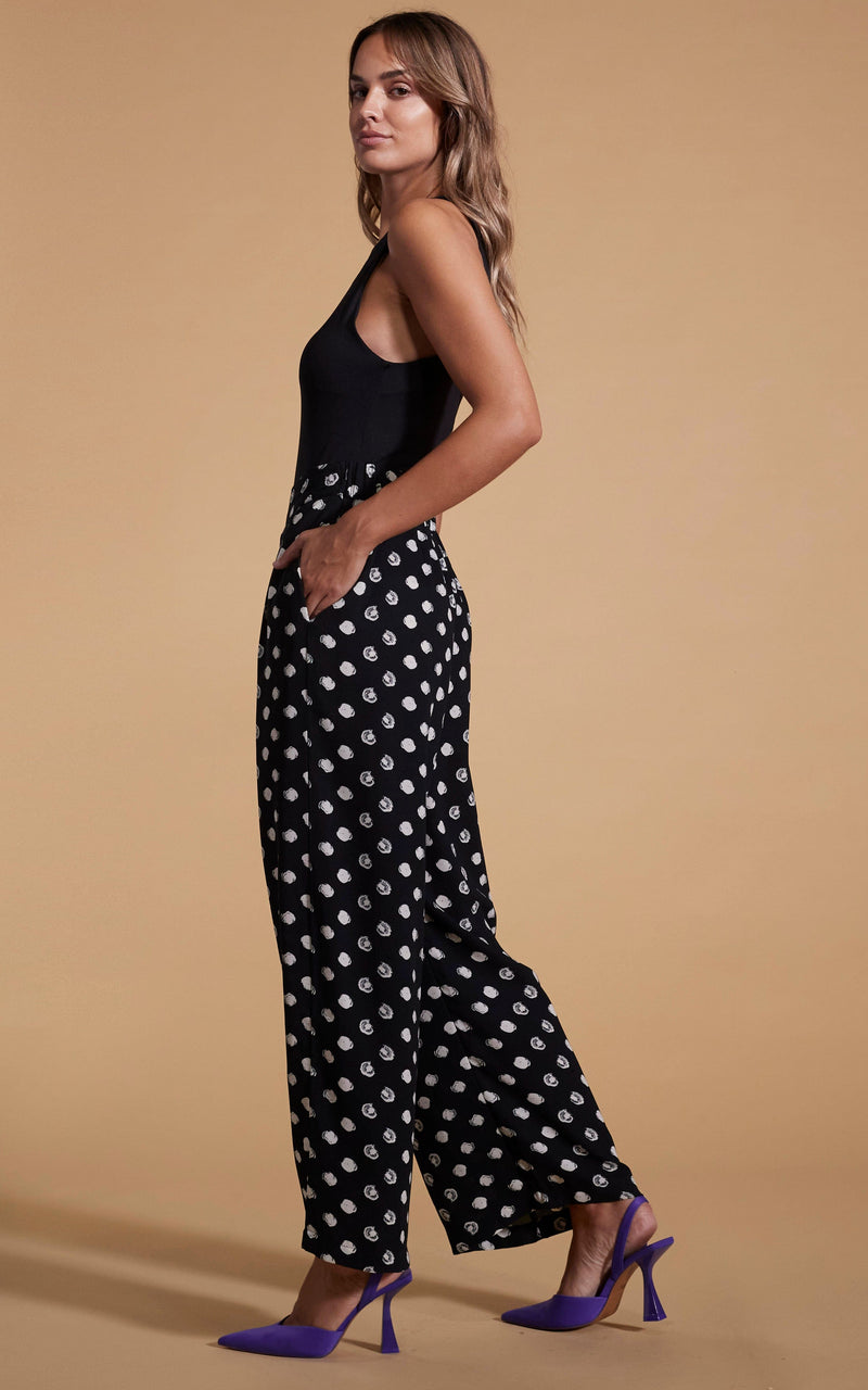Dancing Leopard model wearing Joey Palazzo Trousers in Painted Dot facing side on