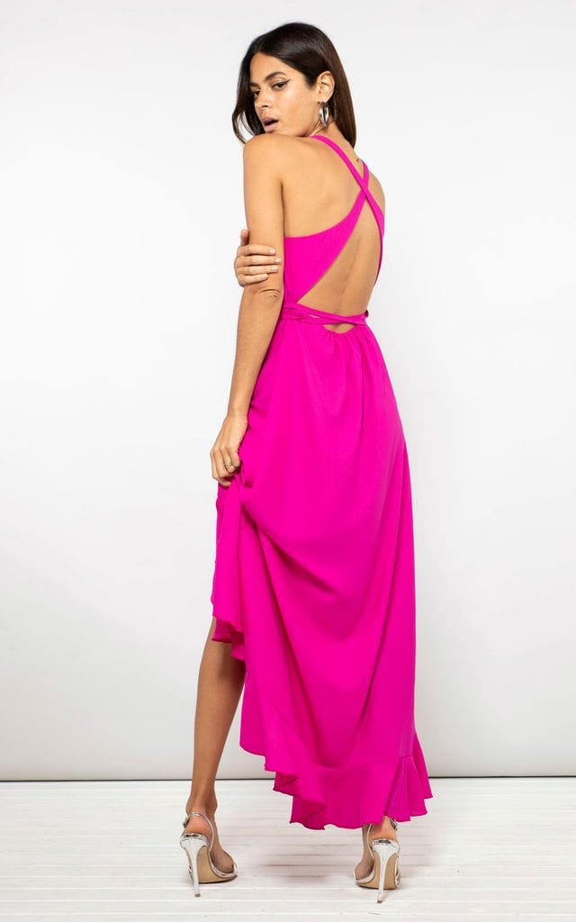 Dancing Leopard back-facing model wears Dolce Vita Dress in magenta pink